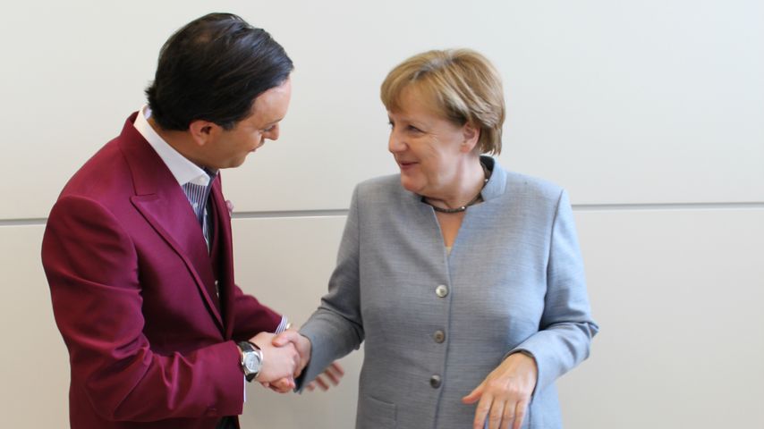 Julian F.M. Stoeckel und Angela Merkel