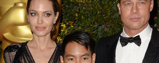Angelina Jolie und Brad Pitt mit Sohn Maddox im Jahr 2013 Angelina Jolie und Brad Pitt mit Sohn Maddox im Jahr 2013