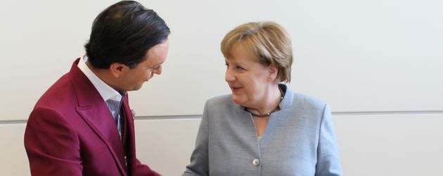 Julian F.M. Stoeckel und Angela Merkel Julian F.M. Stoeckel und Angela Merkel